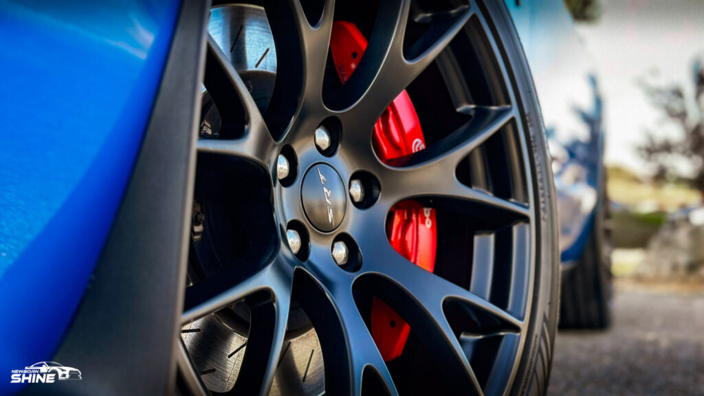 2016 Blue Dodge Challenger Hellcat Auto Detailing and Ceramic Coating - Driver Front Wheel Logo Mid